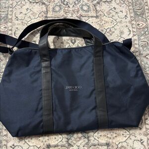 Jimmy Choo Parfums Navy Blue Tote Bag
Travel Carry On